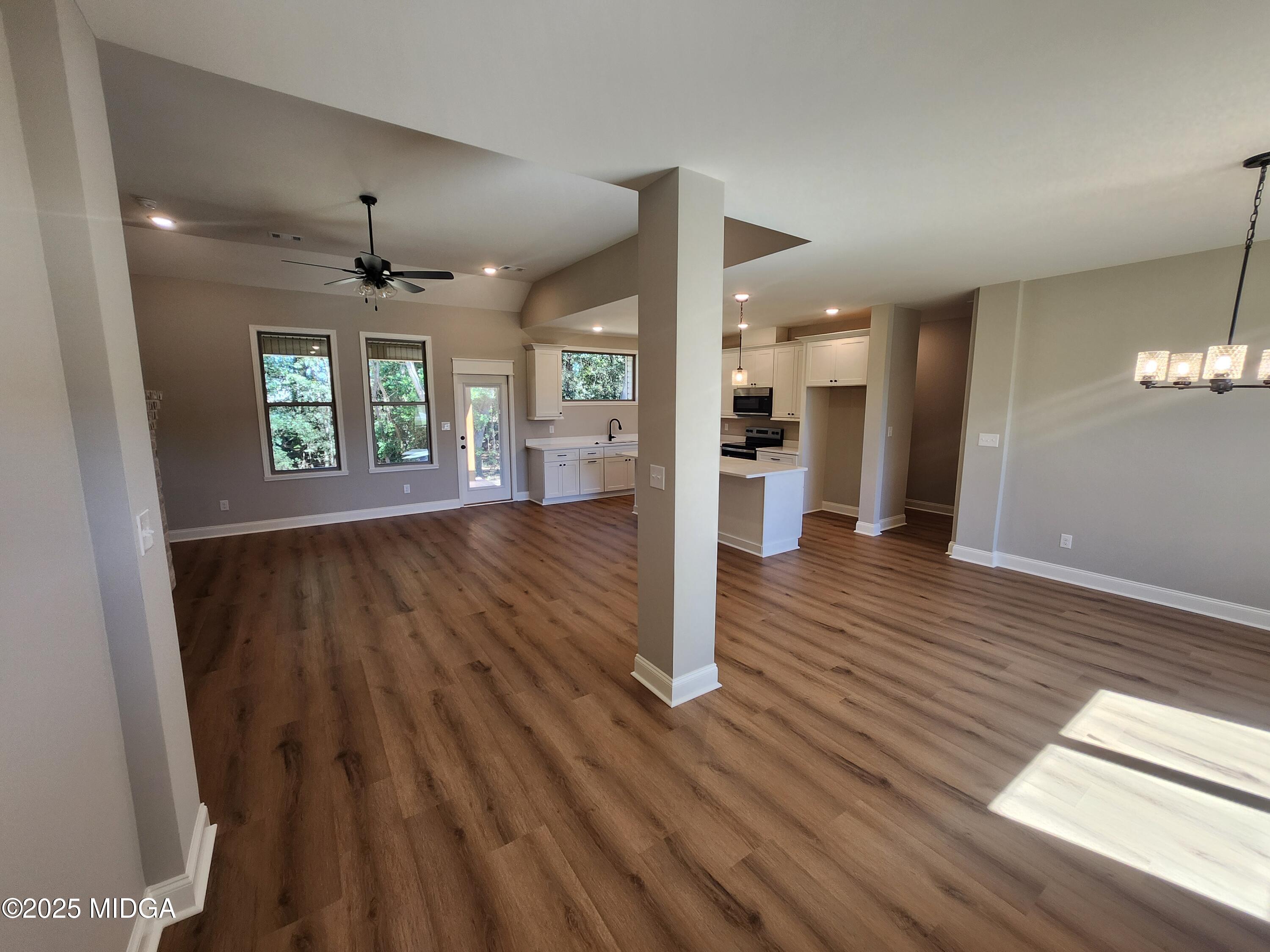 404 Minter Drive Warner Robins, GA 31088 - Photo 14 of 60 wooden floor in an empty room with a window