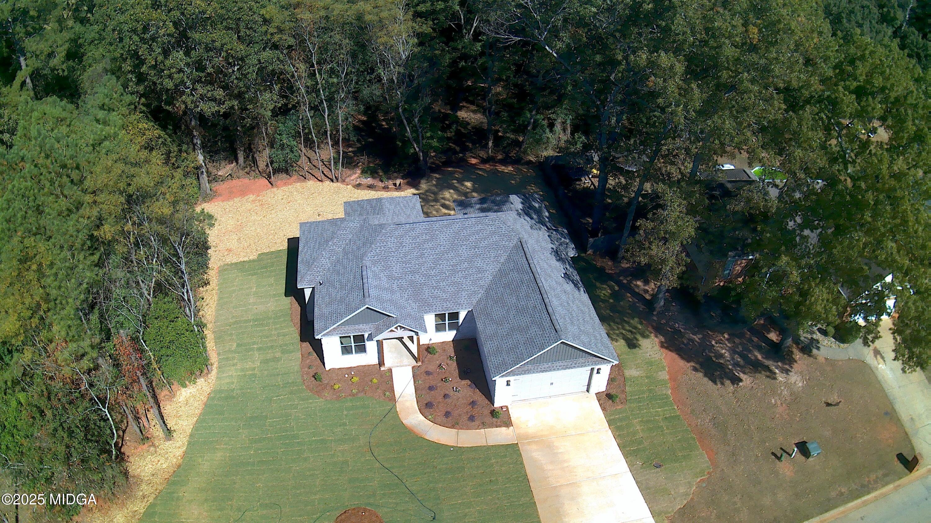 404 Minter Drive Warner Robins, GA 31088 - Photo 3 of 60 an aerial view of a house with yard swimming pool and outdoor seating