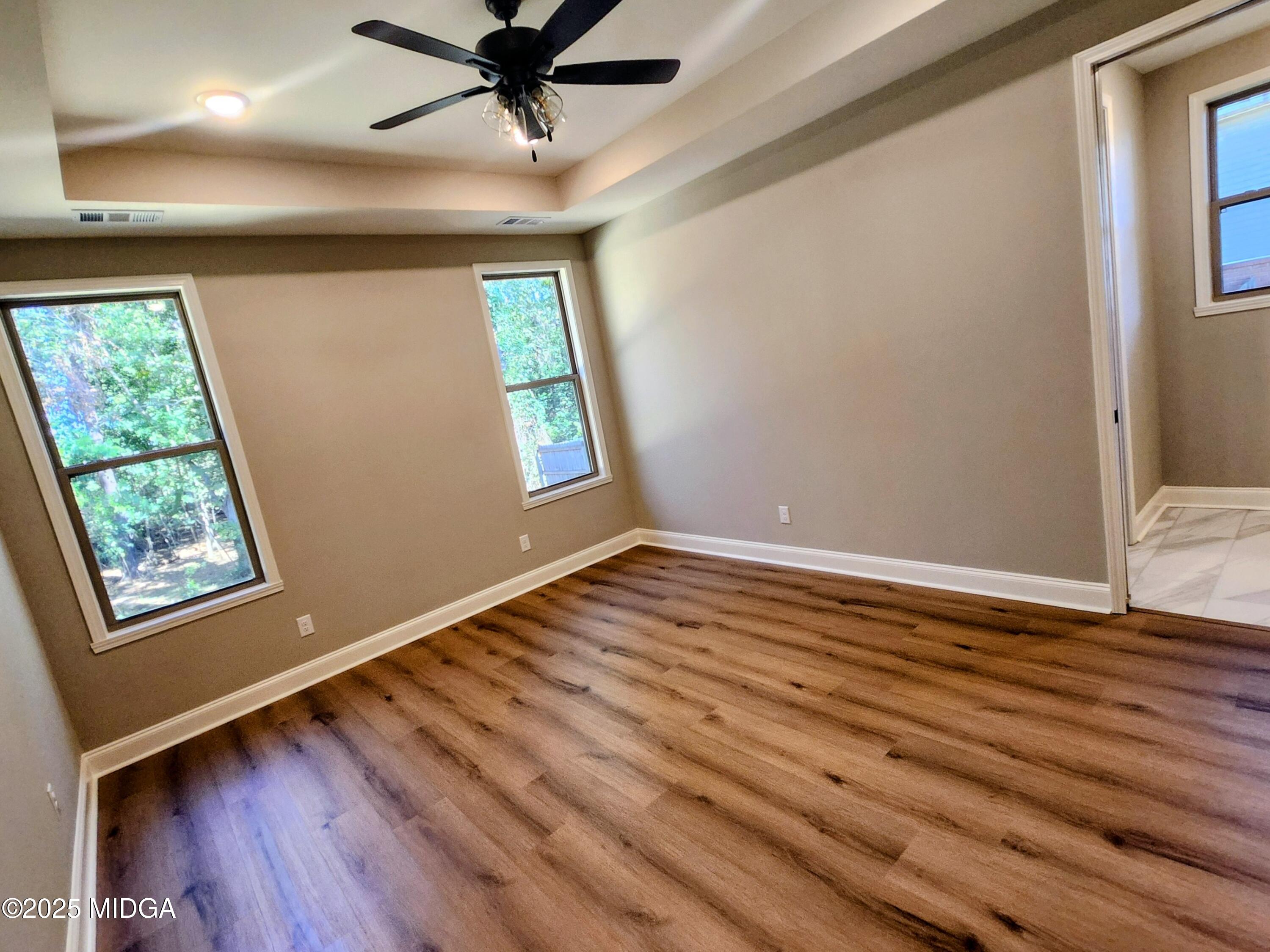 404 Minter Drive Warner Robins, GA 31088 - Photo 32 of 60 a view of room with window and wooden floor