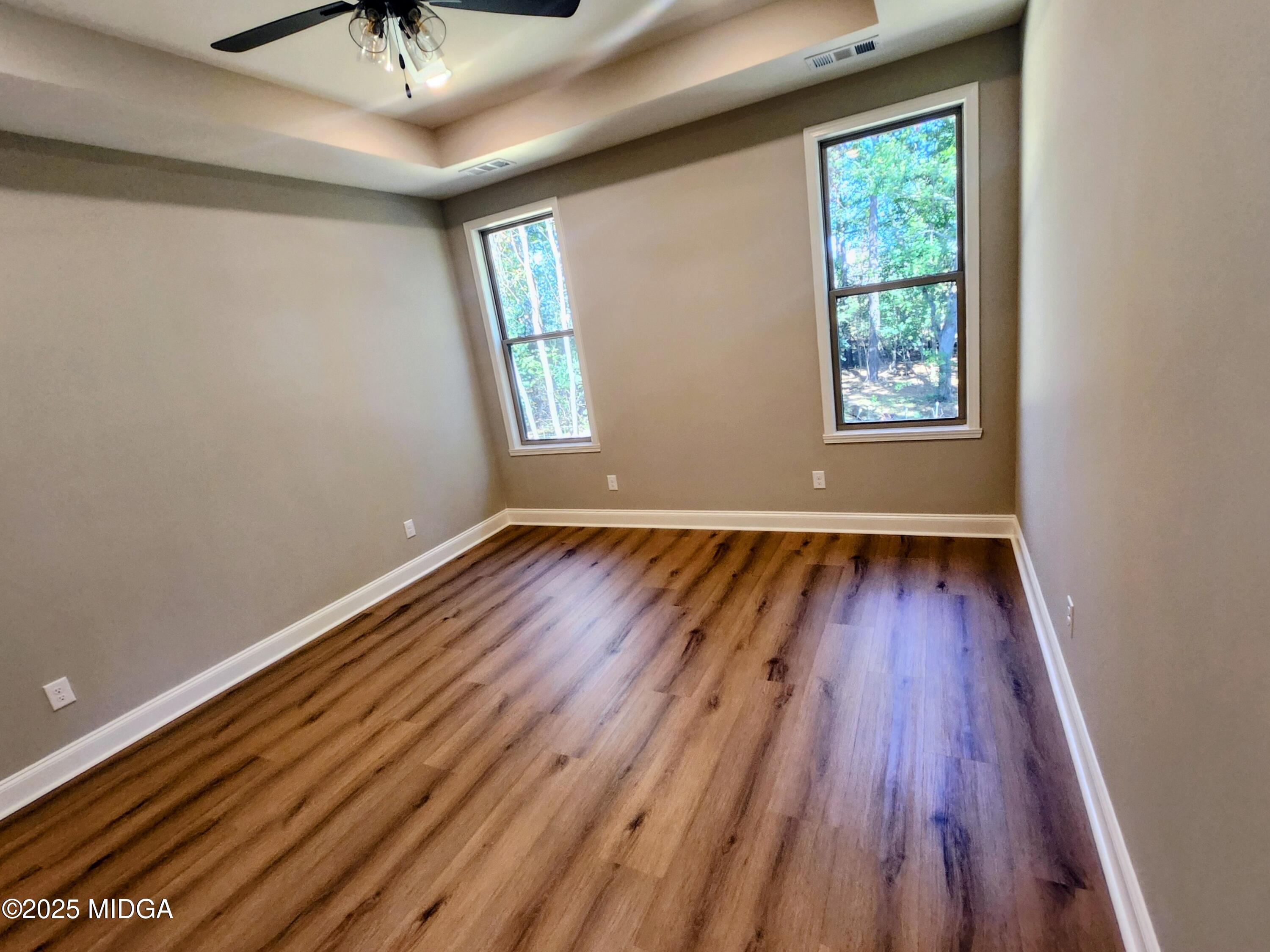 404 Minter Drive Warner Robins, GA 31088 - Photo 33 of 60 wooden floor in an empty room with a window