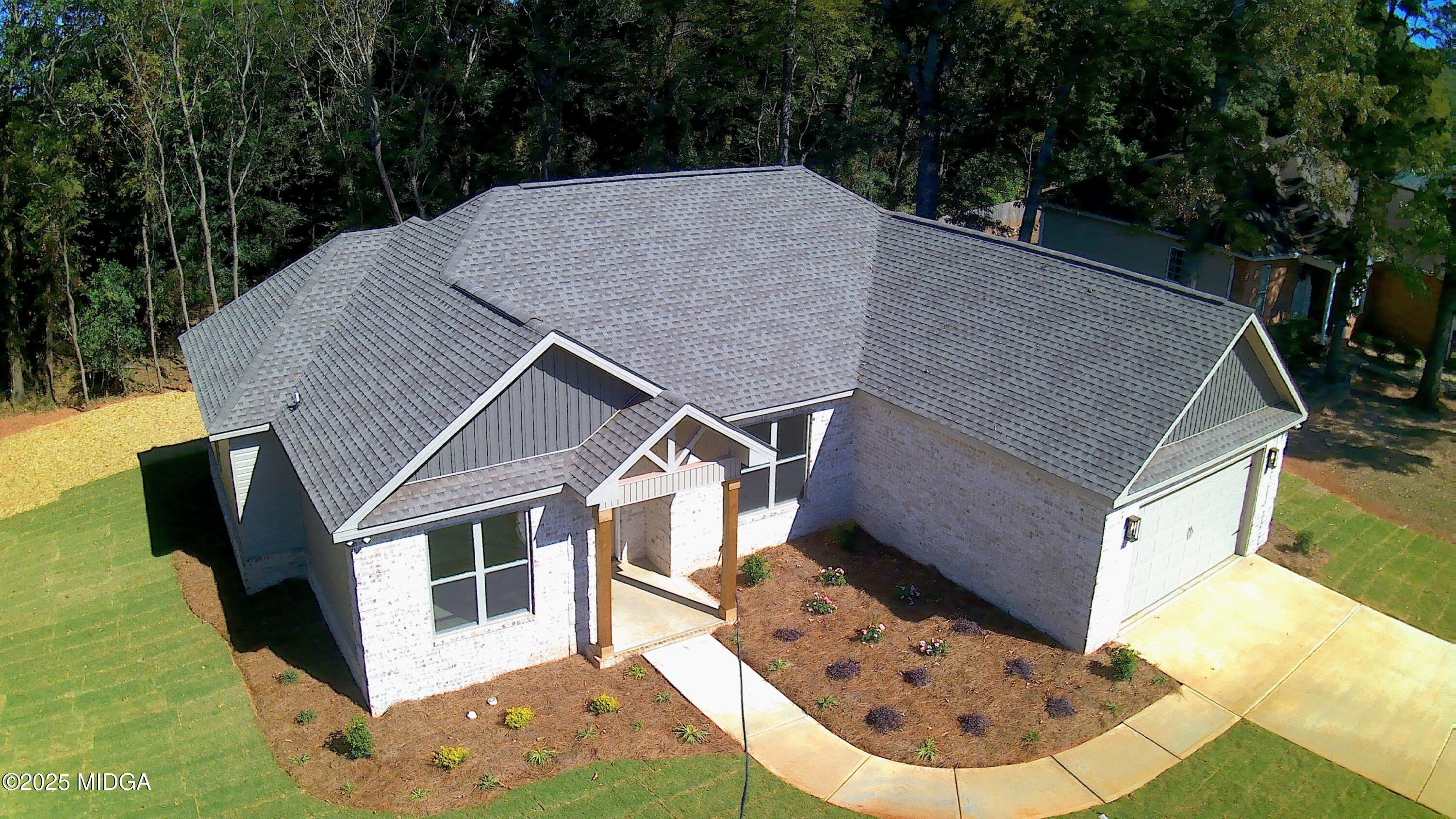 404 Minter Drive Warner Robins, GA 31088 - Photo 4 of 60 a house with trees in the background