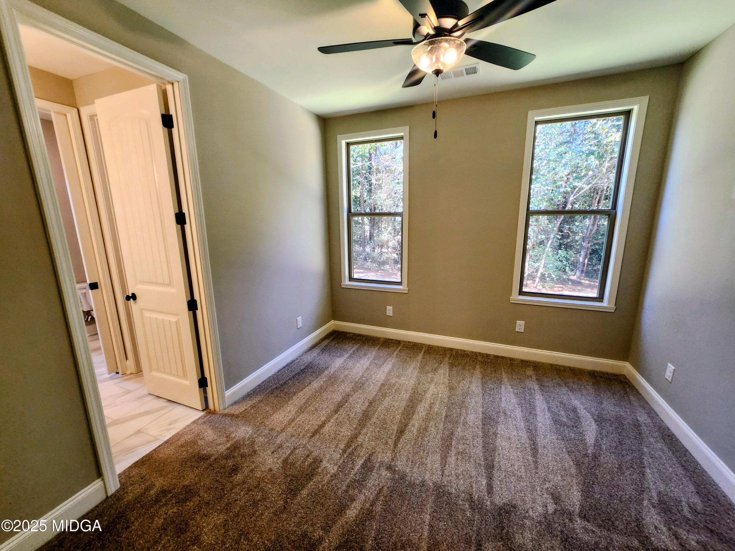 404 Minter Drive Warner Robins, GA 31088 - Photo 42 of 60 a view of an empty room and wooden floor