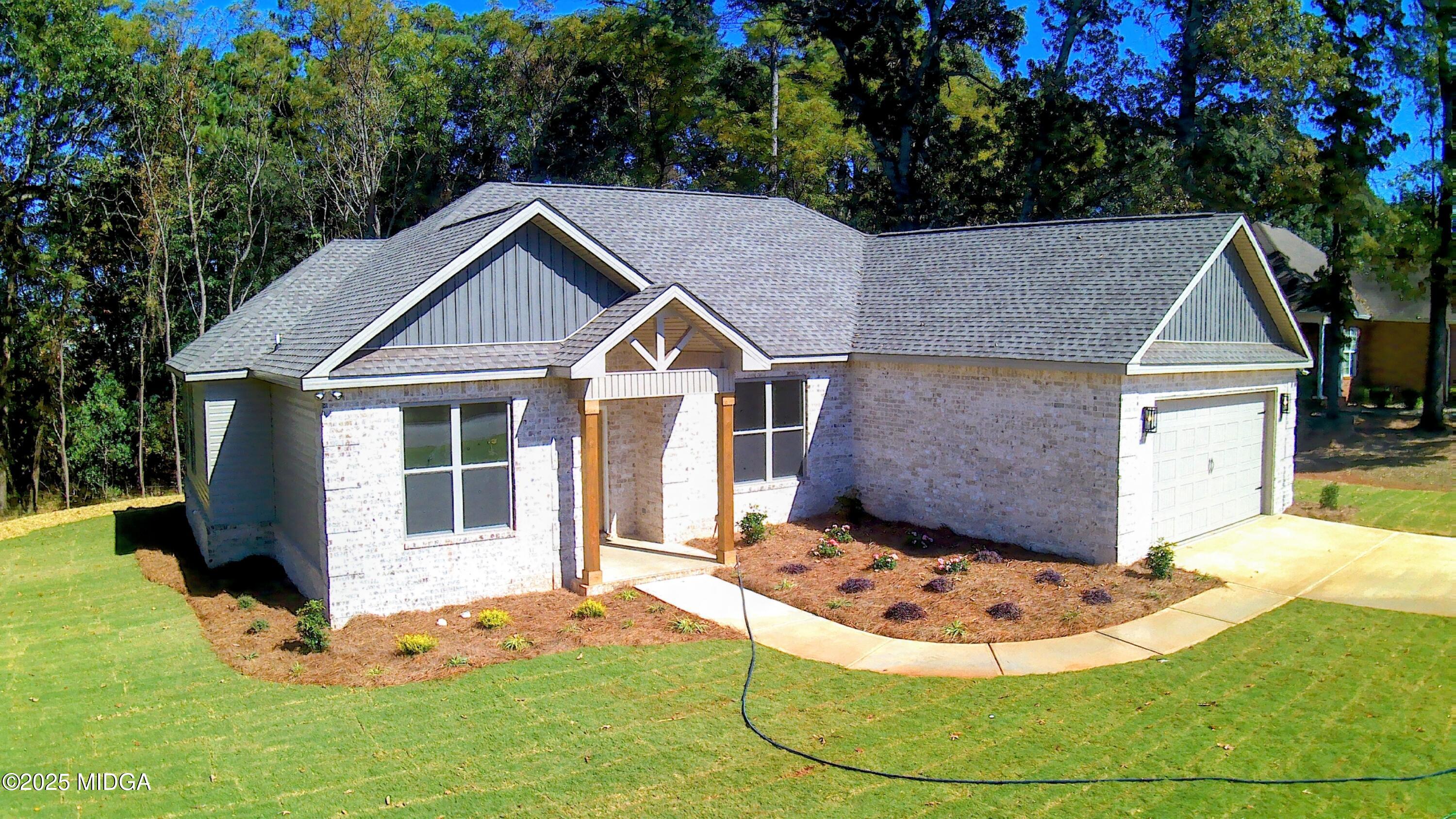 404 Minter Drive Warner Robins, GA 31088 - Photo 5 of 60 a view of a house with a yard