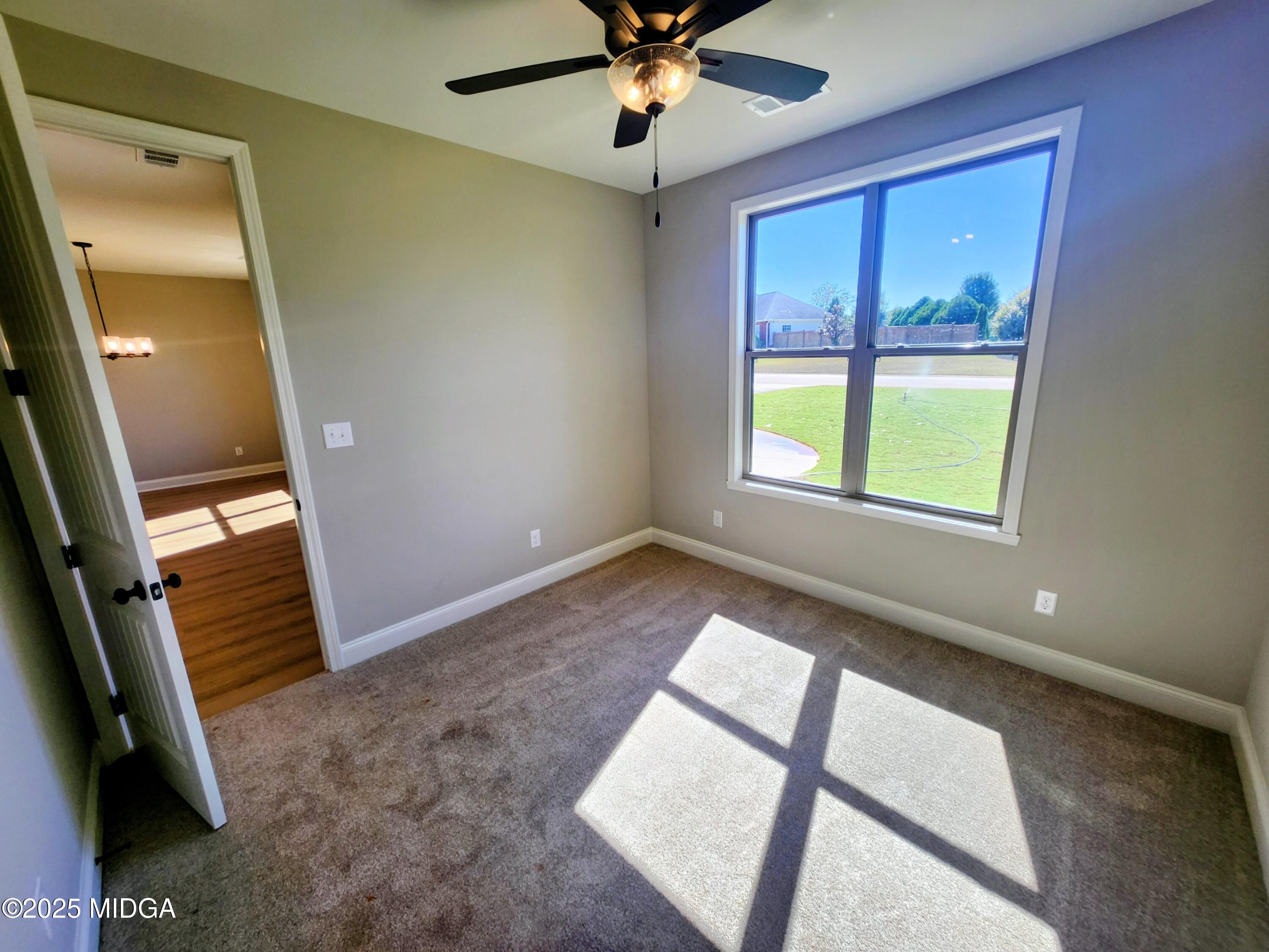 404 Minter Drive Warner Robins, GA 31088 - Photo 51 of 60 wooden floor and window in an empty room