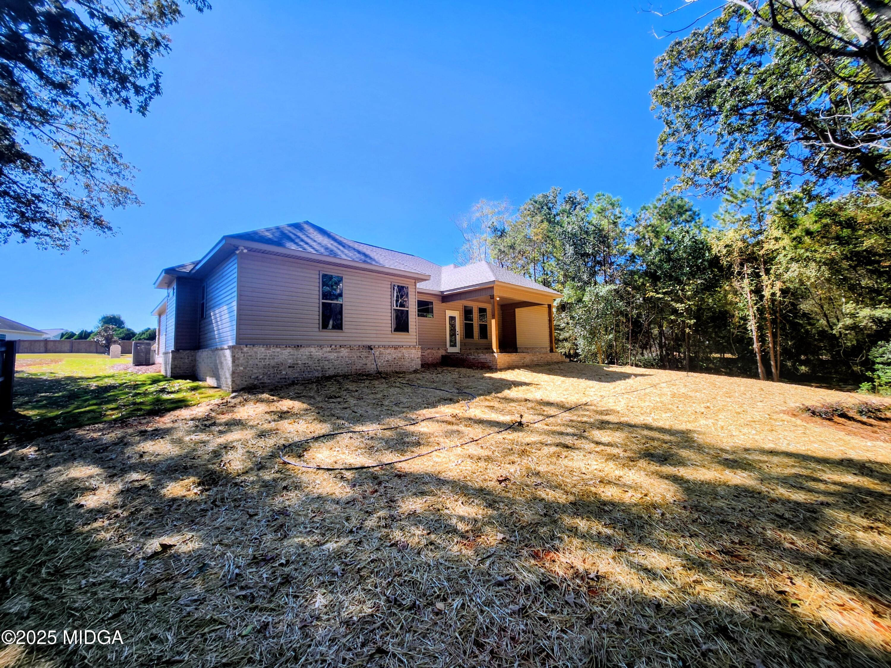404 Minter Drive Warner Robins, GA 31088 - Photo 55 of 60 a front view of a house with a yard