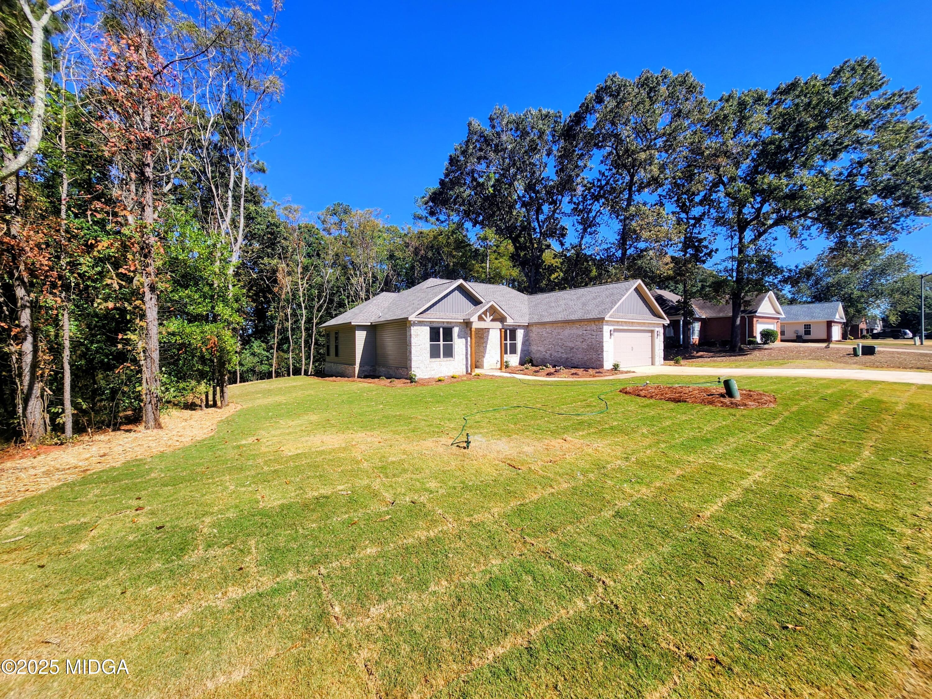 404 Minter Drive Warner Robins, GA 31088 - Photo 60 of 60 a house view with swimming pool in front of it