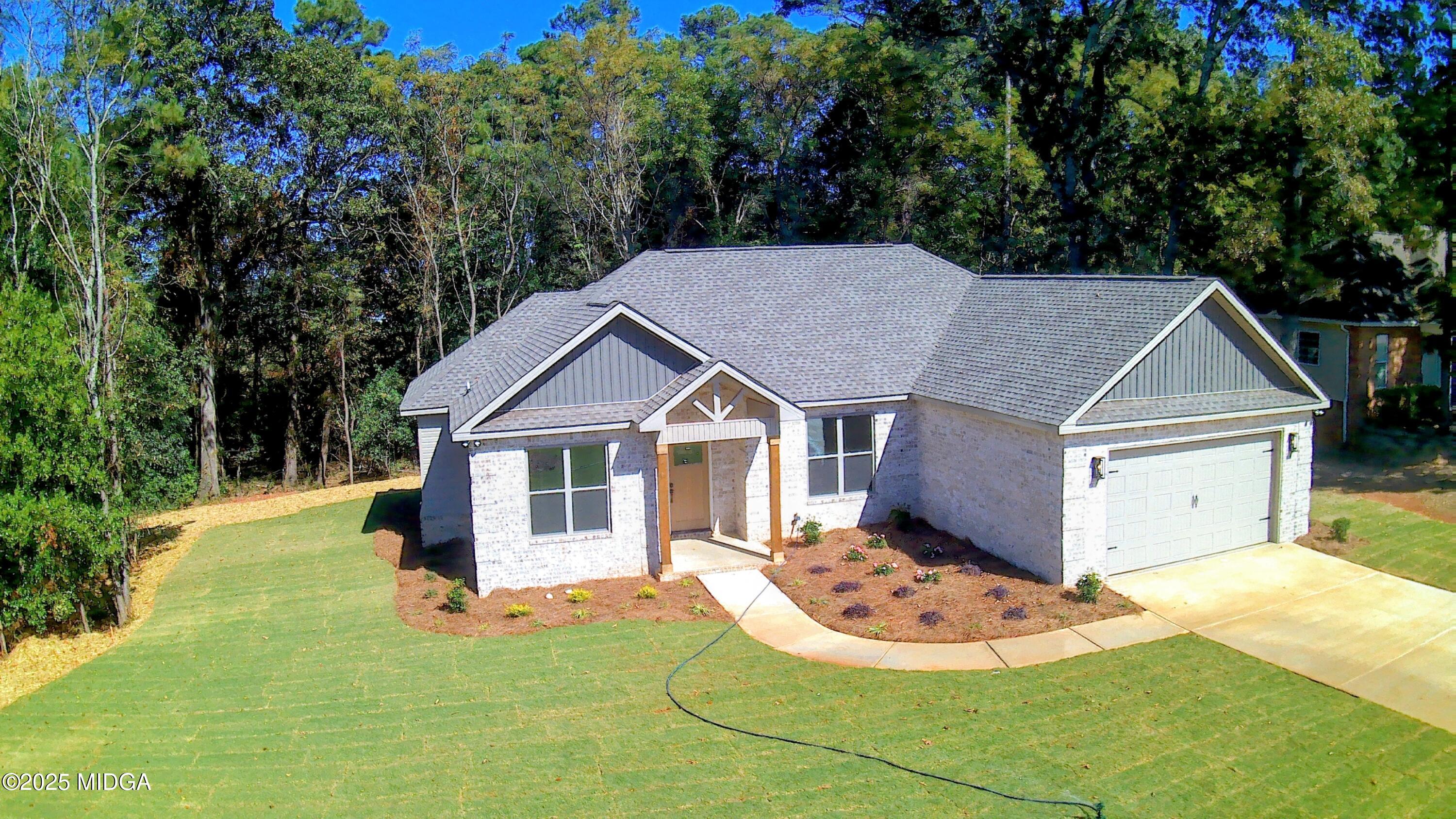 404 Minter Drive Warner Robins, GA 31088 - Photo 7 of 60 a view of a house with a yard