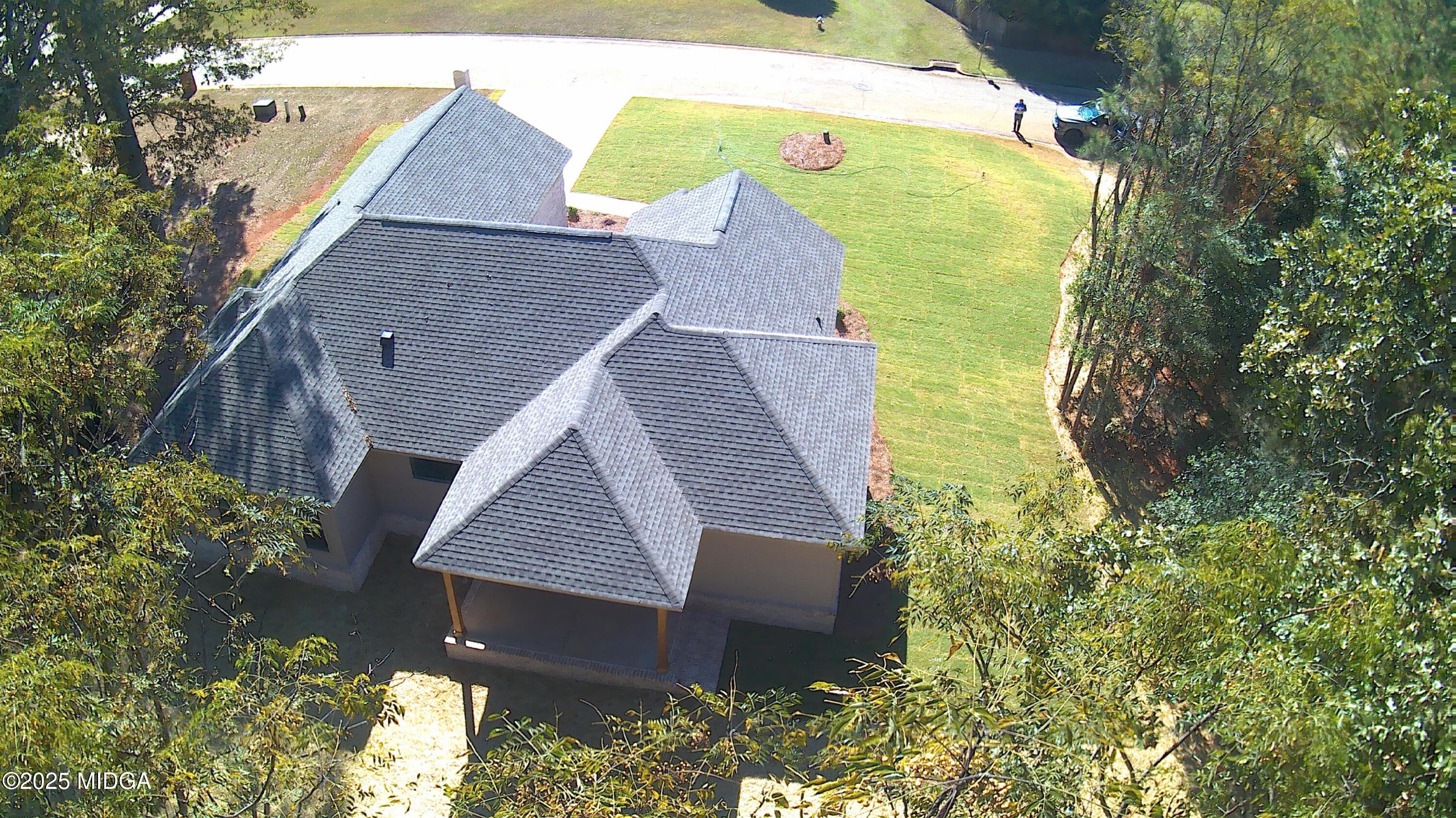 404 Minter Drive Warner Robins, GA 31088 - Photo 8 of 60 a aerial view of a house with swimming pool and garden