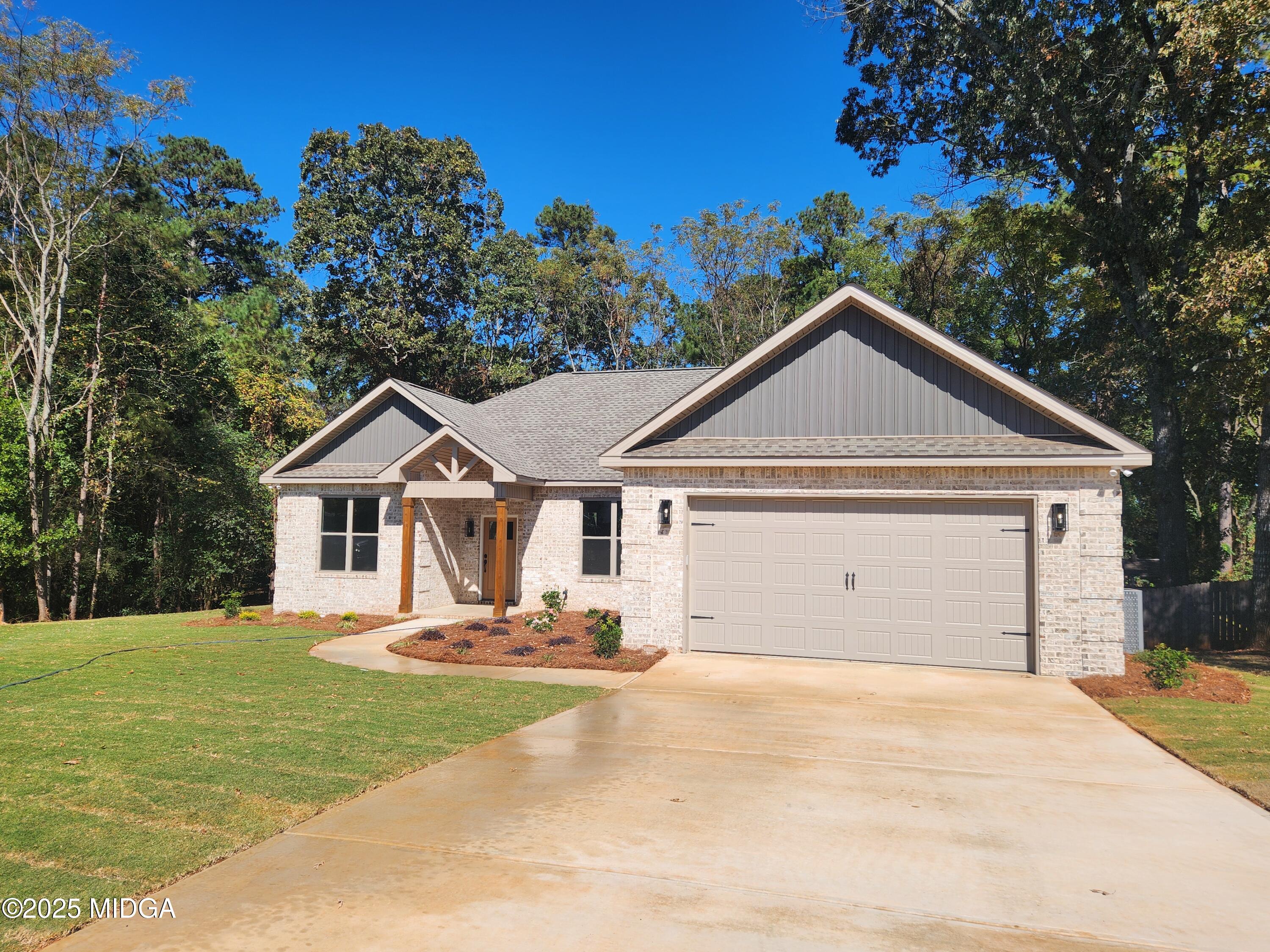 404 Minter Drive Warner Robins, GA 31088 - Photo 10 of 60 a view of a house with a yard