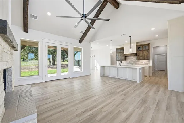 a view of kitchen with cabinets and wooden floor