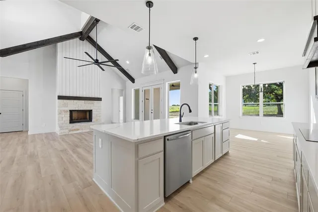 a kitchen with sink and stove