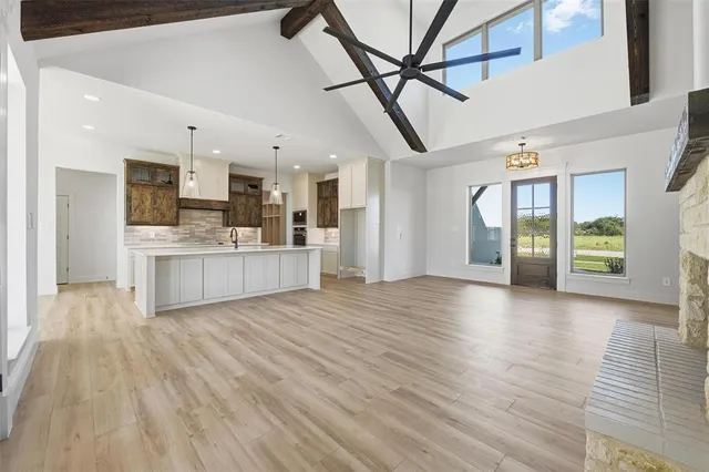 a view of kitchen and hall with wooden floor