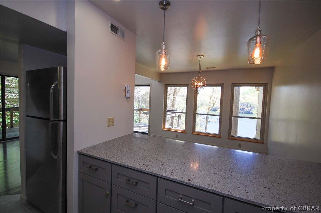 54 D Villa Ridge Drive, Unit D Hartfield, VA 23071 - Photo 11 of 34 LOVELY VIEWS FROM KITCHEN INTO DINING AREA