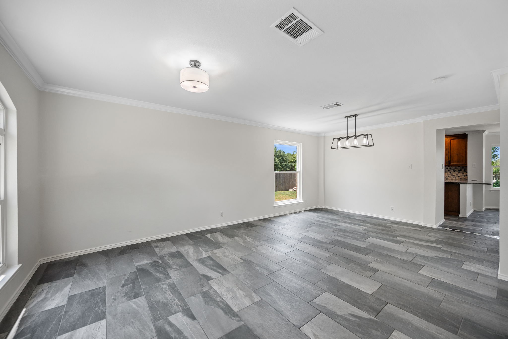 2440 Madeline Loop Cedar Park, TX 78613 - Photo 5 of 33 Empty room with ornamental molding