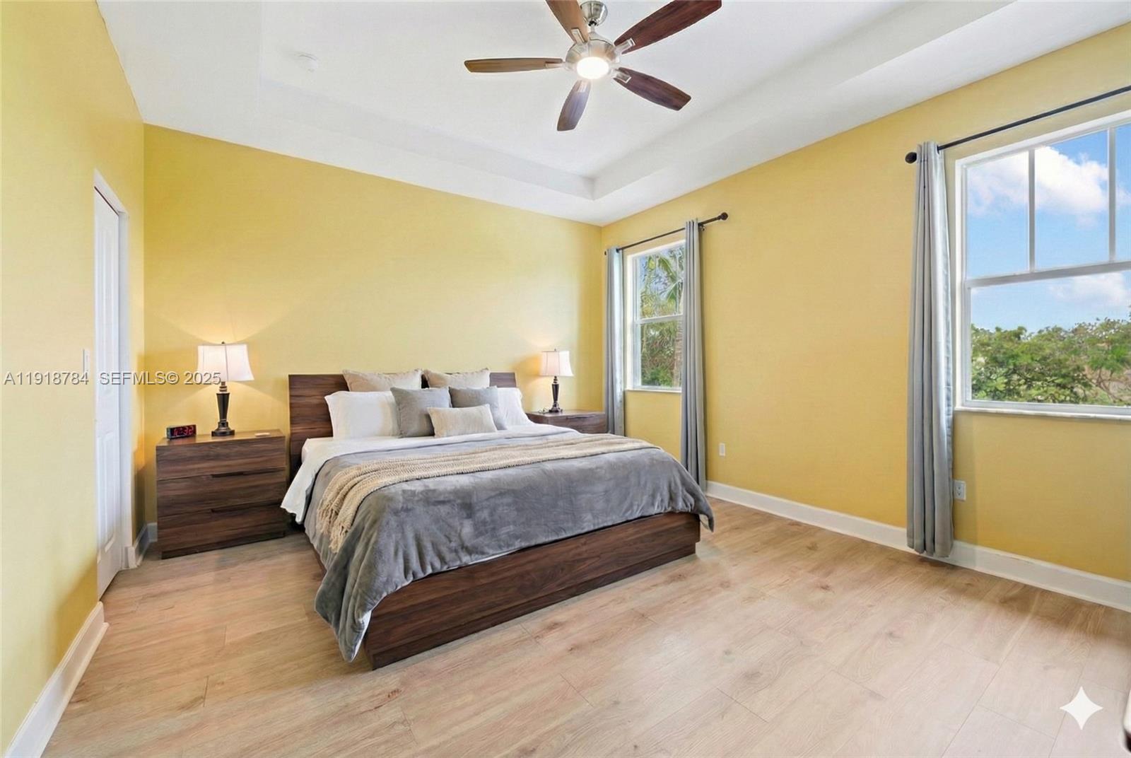 4501 Northwest 48th Terrace Tamarac, FL 33319 - Photo 11 of 18 Spacious primary bedroom with excellent flow, virtually decluttered and staged for a clean and open look.