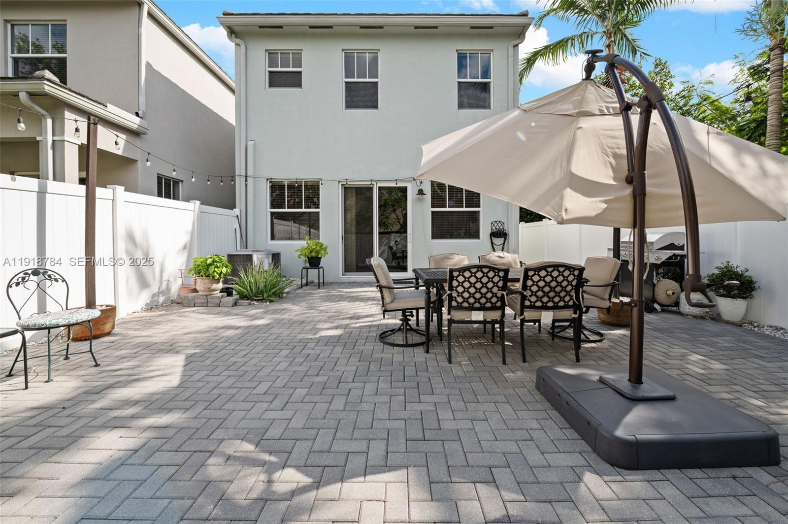 4501 Northwest 48th Terrace Tamarac, FL 33319 - Photo 2 of 18 Your private outdoor oasis—perfect for morning coffee, grilling, or gatherings. Patio furniture is included in the sale at no additional costs to you!