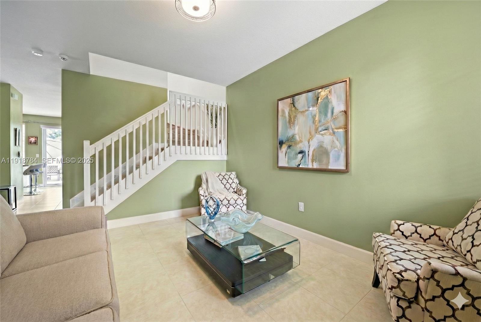 4501 Northwest 48th Terrace Tamarac, FL 33319 - Photo 3 of 18 Bright front sitting room—perfect as a home office or reading retreat, virtually decluttered for presentation
