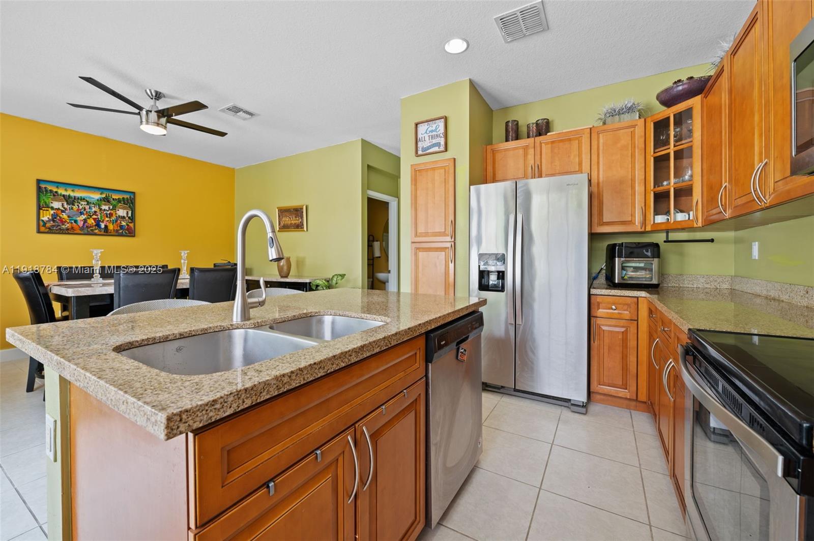 4501 Northwest 48th Terrace Tamarac, FL 33319 - Photo 6 of 18 Open layout lets you stay connected while cooking—ideal for busy families and guests.