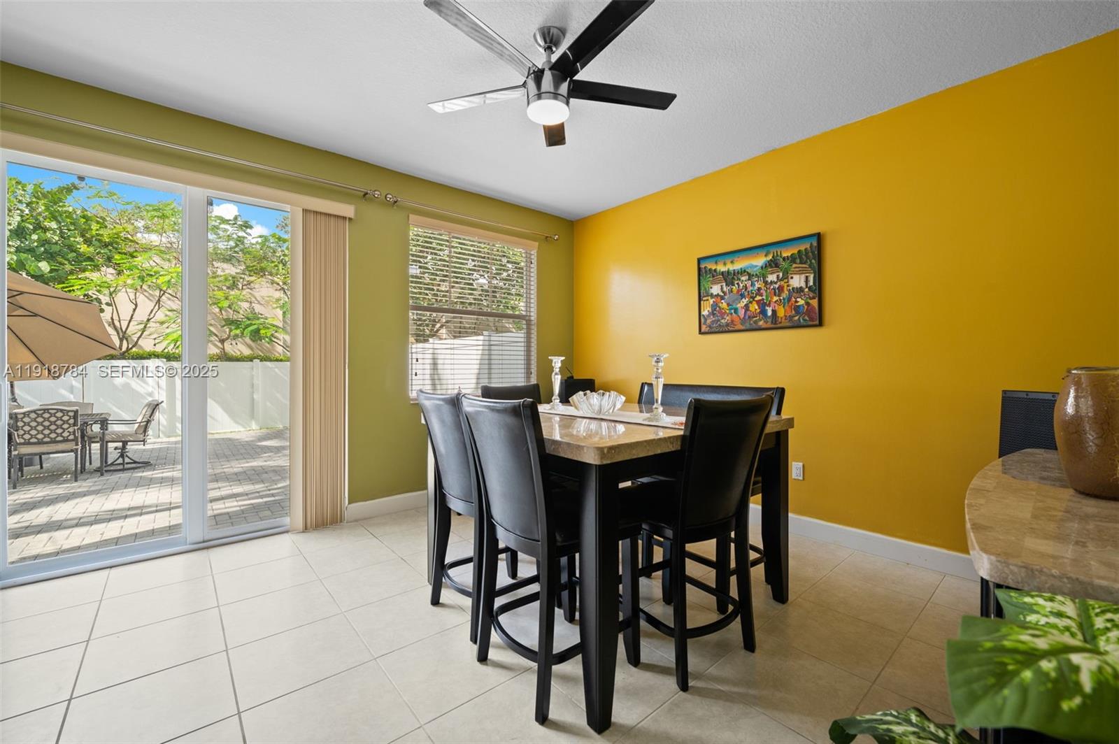4501 Northwest 48th Terrace Tamarac, FL 33319 - Photo 7 of 18 Cozy dining area overlooking the backyard—perfect for family meals or game nights