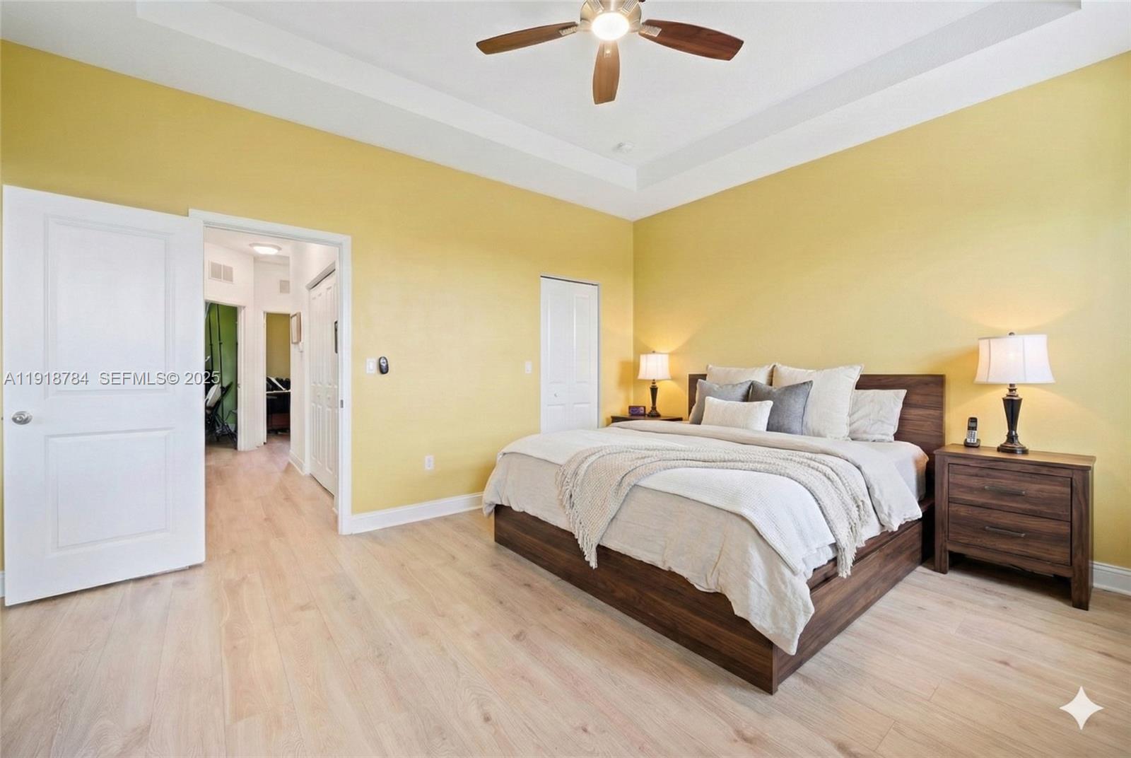 4501 Northwest 48th Terrace Tamarac, FL 33319 - Photo 10 of 18 Large primary suite with abundant natural light, virtually decluttered and staged to highlight layout and space