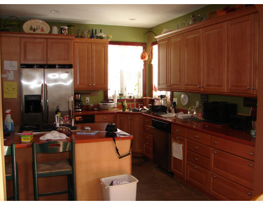 8 North County Road Princeton, MA 01541 - Photo 20 of 24 a kitchen with granite countertop a refrigerator stove top oven and cabinets