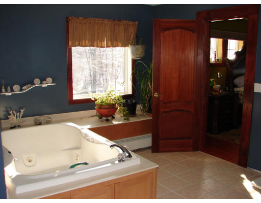 8 North County Road Princeton, MA 01541 - Photo 24 of 24 a bathroom with a tub sink and mirror