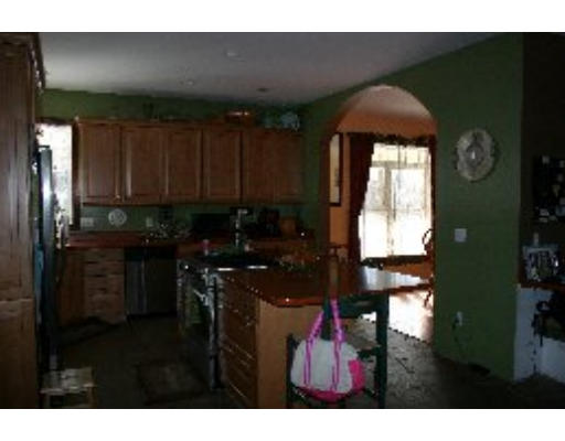 8 North County Road Princeton, MA 01541 - Photo 8 of 24 a kitchen with a refrigerator a stove and a microwave oven