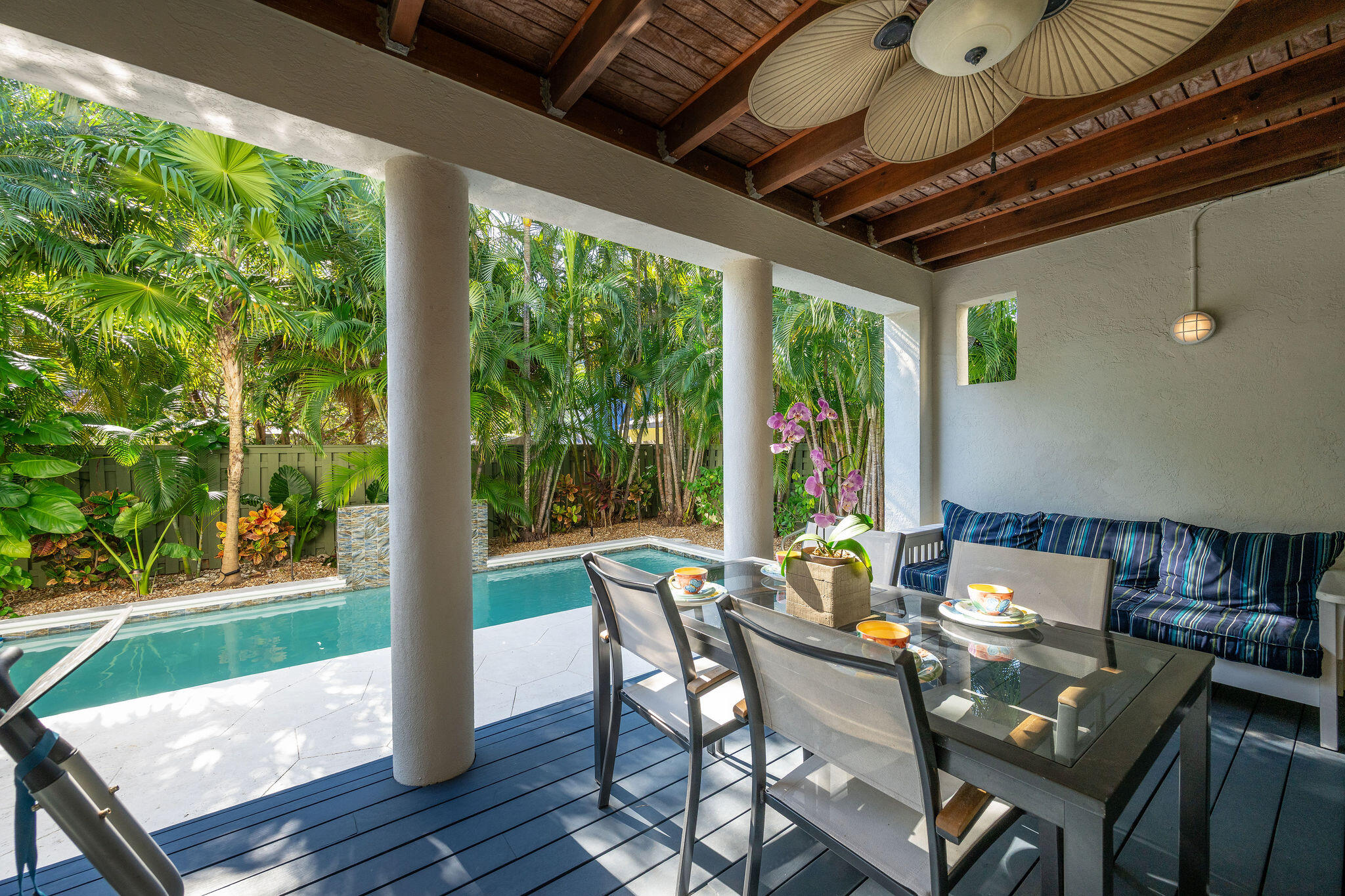 1422 Patricia Street Key West, FL 33040 - Photo 33 of 61 a dining room with furniture a chandelier and wooden floor