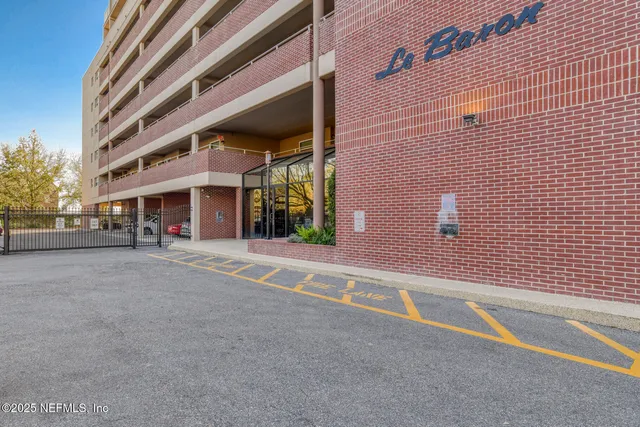 a view of a building with a street