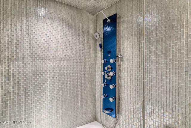 a view of a hallway with washer and dryer