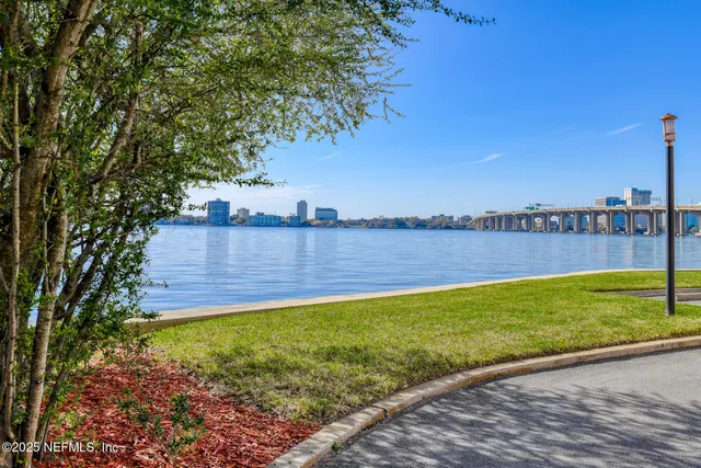 a view of a car is parked in front of a building