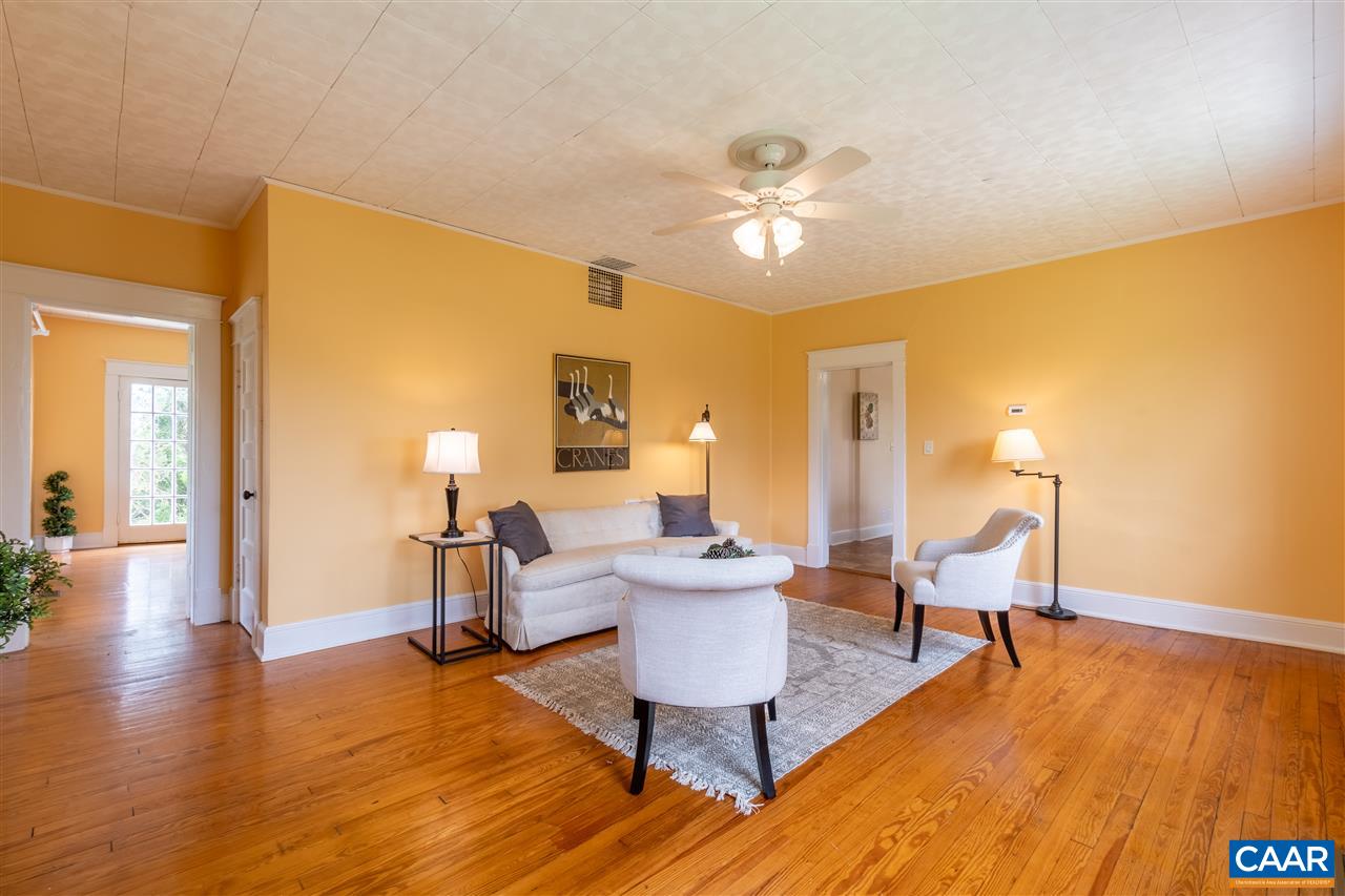 4308 Millington Road Free Union, VA 22940 - Photo 14 of 43 a living room with furniture and a wooden floor