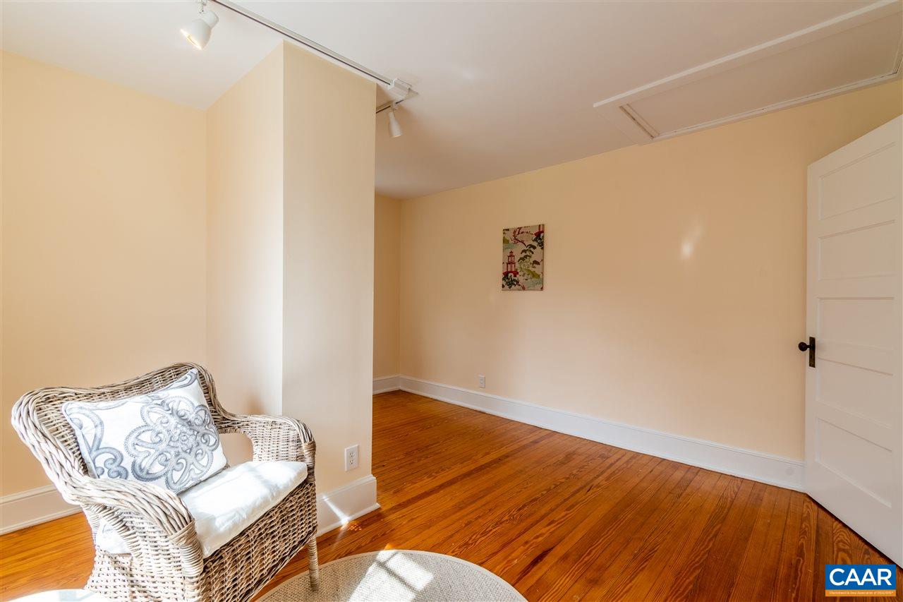 4308 Millington Road Free Union, VA 22940 - Photo 32 of 43 a living room with a couch and a table with wooden floor