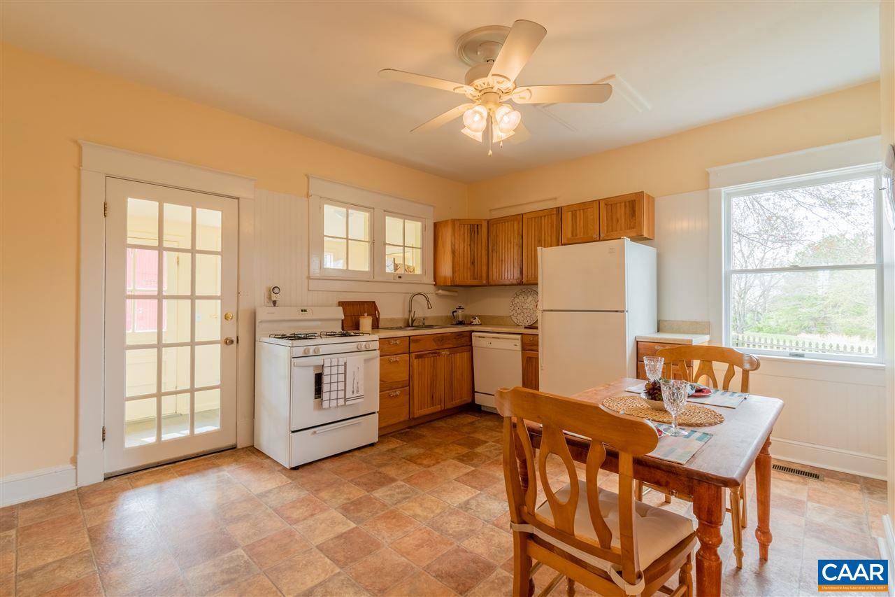 4308 Millington Road Free Union, VA 22940 - Photo 8 of 43 a kitchen with a refrigerator a table and chairs