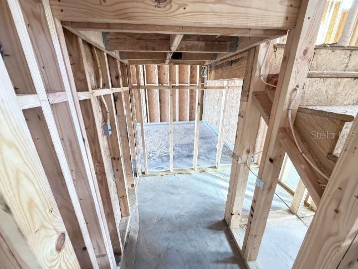 30150 Rustic Mill Street Mount Dora, FL 32757 - Photo 13 of 37 a view of an empty room with wooden floor and door