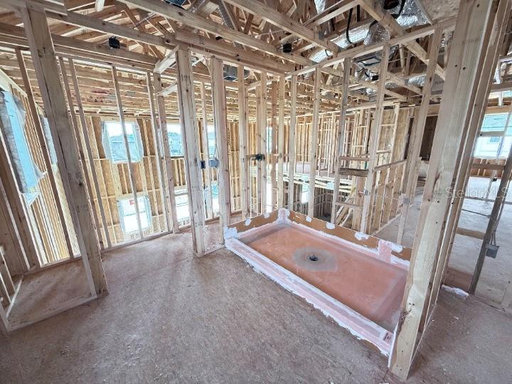 30150 Rustic Mill Street Mount Dora, FL 32757 - Photo 25 of 37 a bathroom with a tub a sink and a large window