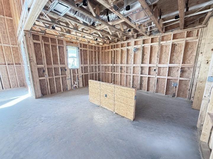 30150 Rustic Mill Street Mount Dora, FL 32757 - Photo 7 of 37 a view of an empty room with white walls