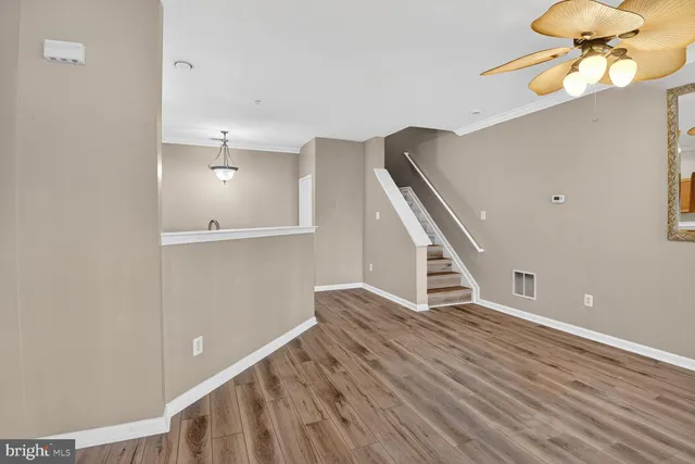 a view of an entryway with wooden floor
