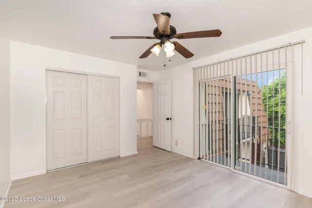 a view of a hallway with a window