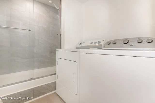 a bathroom with a bathtub and shower