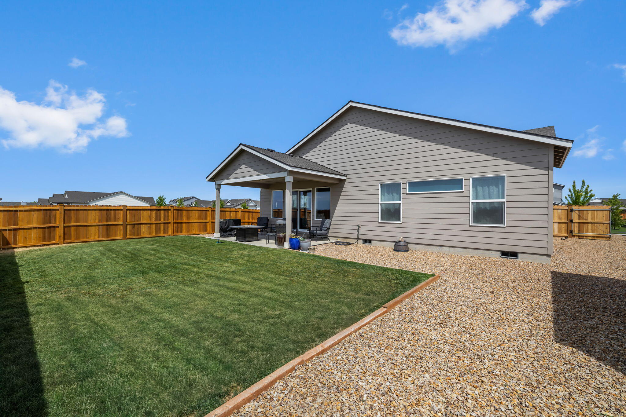 1132 Northwest Golf Course Drive Madras, OR 97741 - Photo 25 of 36 a view of a house with backyard