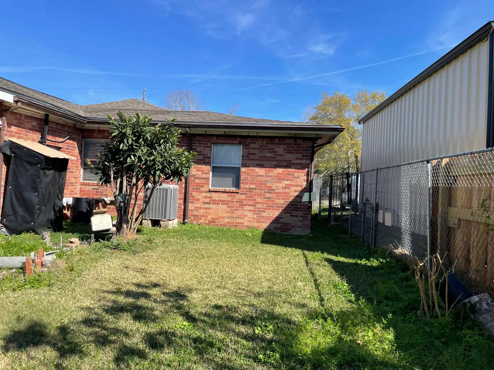 1825 Isom Street Houston, TX 77039 - Photo 7 of 27 a view of a house with a yard