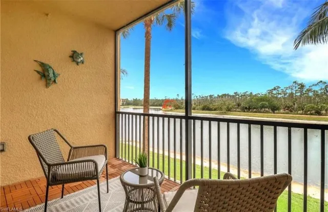 a view of a chair and table in the balcony
