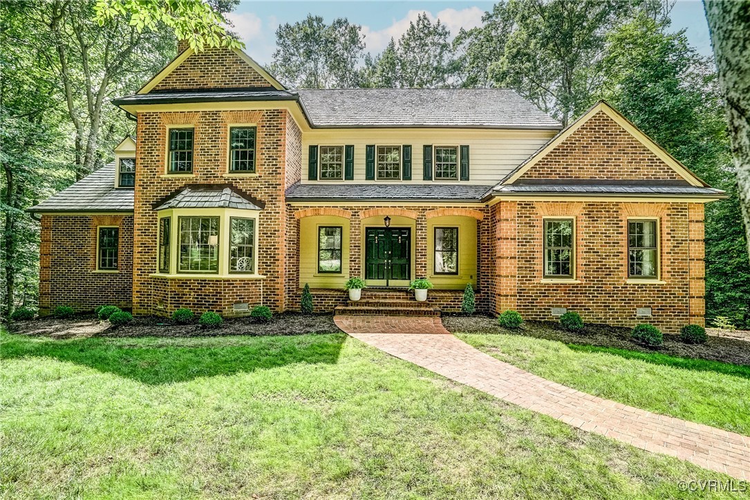 front view of a house with a yard