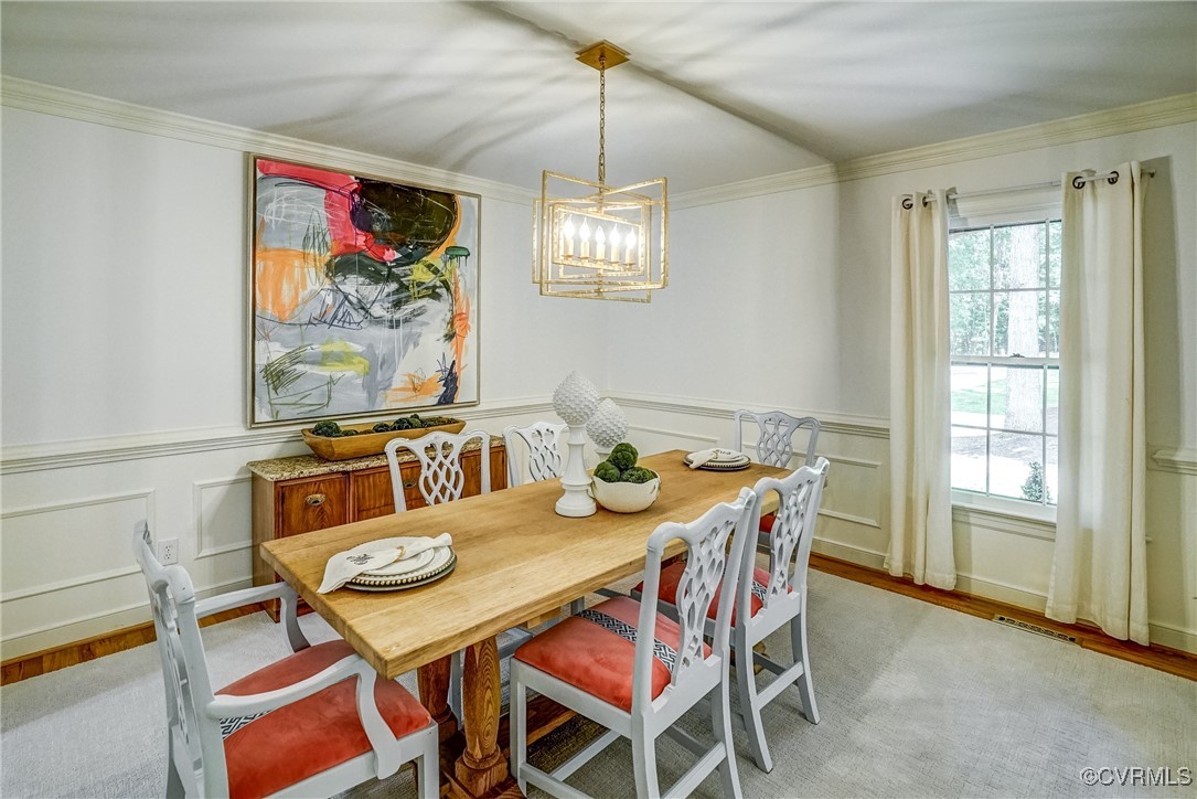 3630 Lansdowne Road Midlothian, VA 23113 - Photo 15 of 50 a view of a dining room with furniture a chandelier and wooden floor
