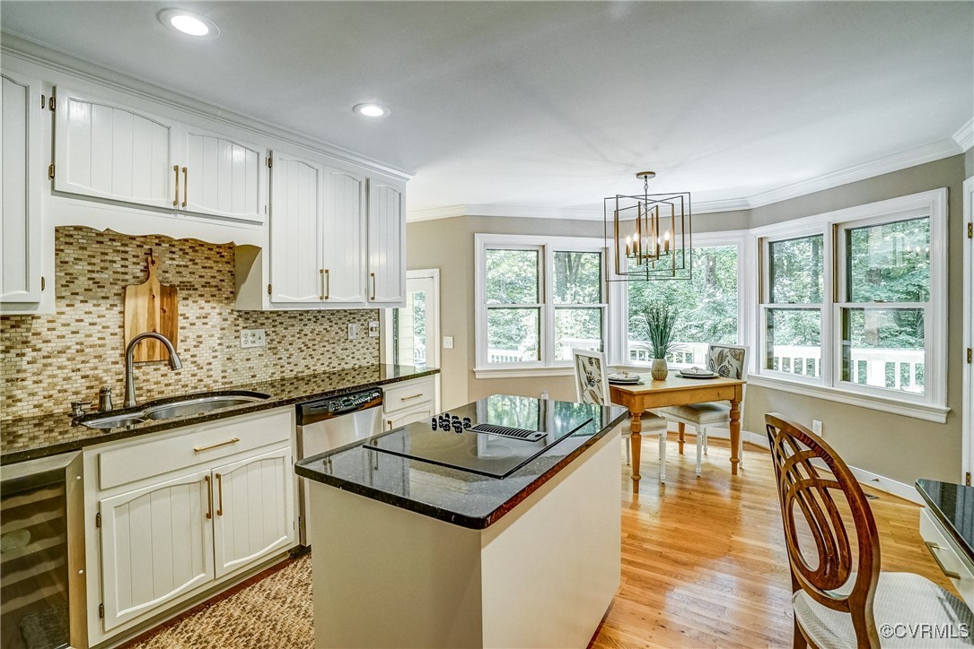 3630 Lansdowne Road Midlothian, VA 23113 - Photo 17 of 50 a kitchen with stainless steel appliances granite countertop a stove top oven a sink dishwasher and white cabinets with wooden floor