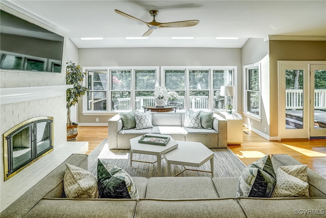 3630 Lansdowne Road Midlothian, VA 23113 - Photo 20 of 50 a living room with fireplace furniture and a floor to ceiling window