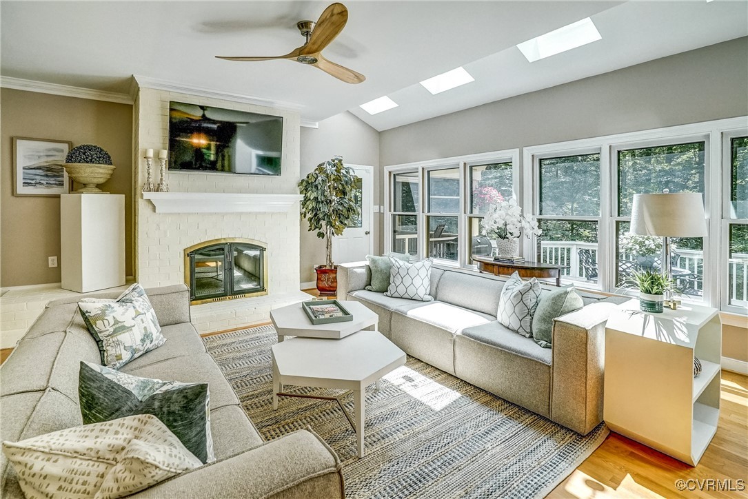 3630 Lansdowne Road Midlothian, VA 23113 - Photo 23 of 50 a living room with furniture a flat screen tv and a fireplace