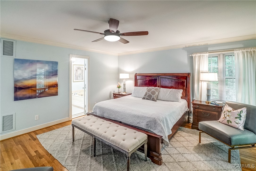 3630 Lansdowne Road Midlothian, VA 23113 - Photo 28 of 50 a bedroom with a bed and a chandelier
