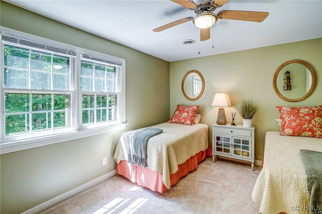 3630 Lansdowne Road Midlothian, VA 23113 - Photo 38 of 50 a bedroom with a bed a chandelier and a window